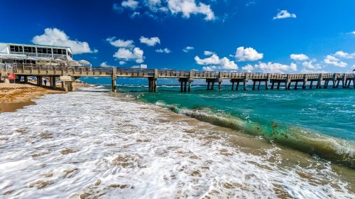 The Lake Worth Florida Pier and Waves on the beach